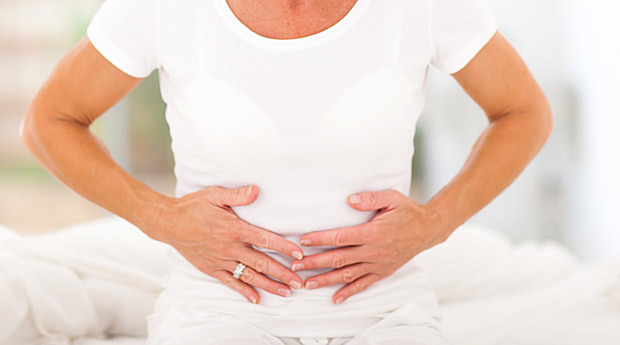 mid age woman having stomach pain